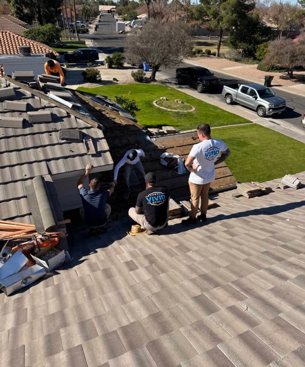 Roofer inspecting a residential roof, Greater Phoenix