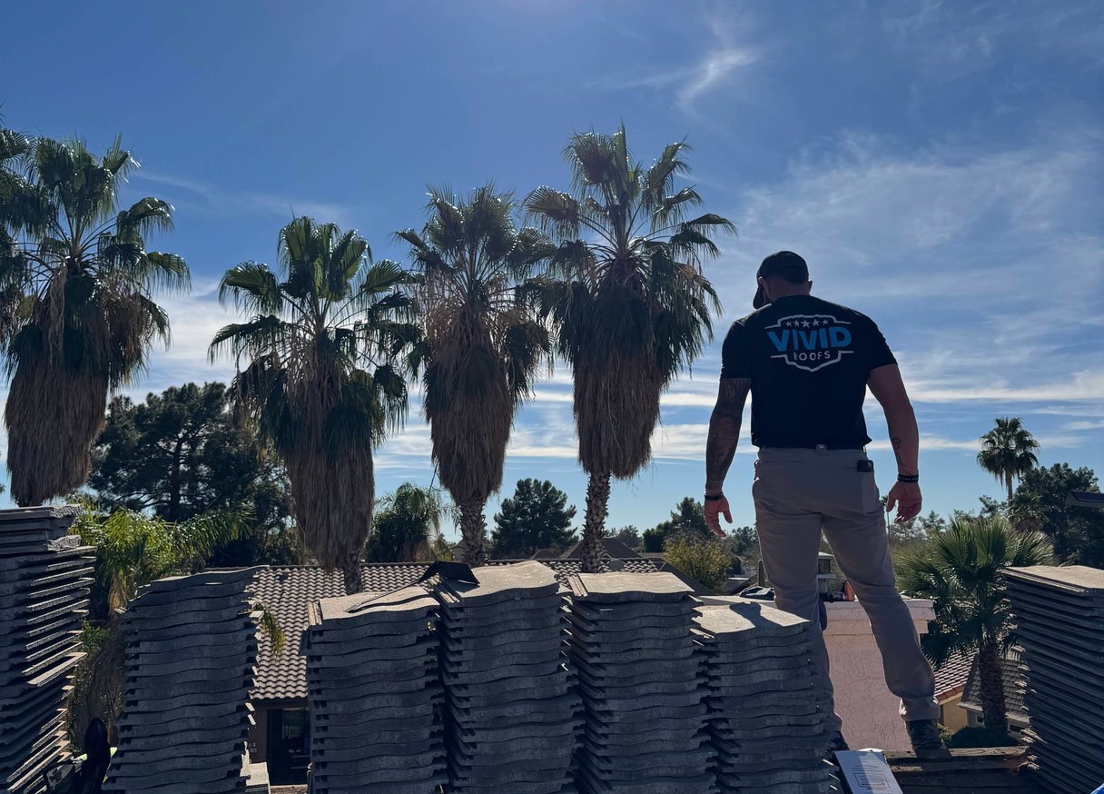 Terracotta tile rooftops overlooking ocean in coastal town