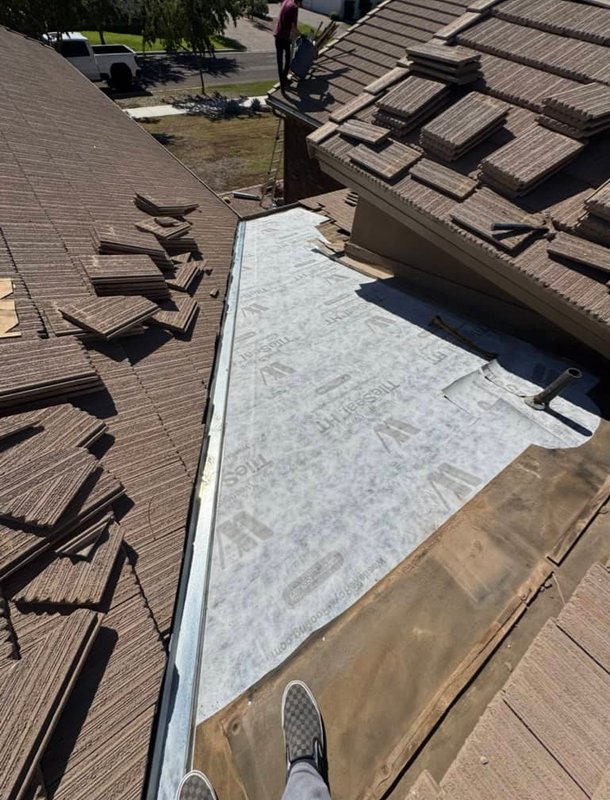 Professional roof repair by Vivid Roofs crew