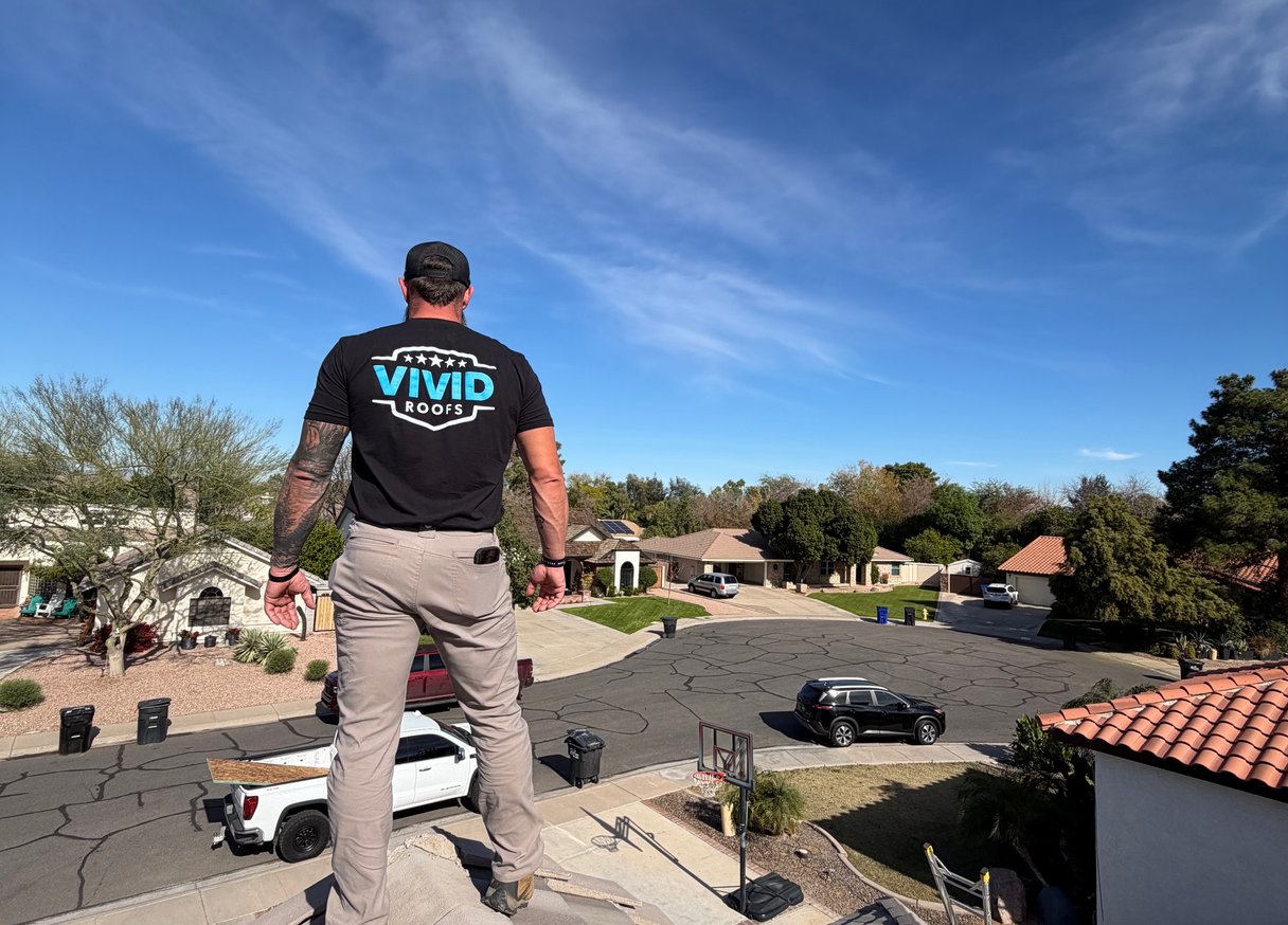Terracotta tile rooftops overlooking ocean in coastal town
